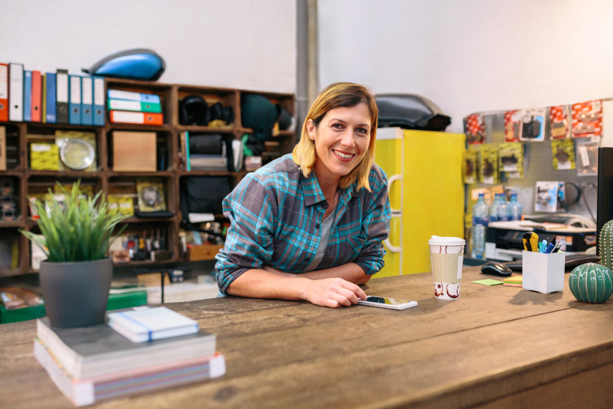 A Meridian Co. team member at her desk, ready to help